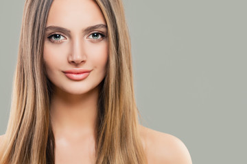 Naklejka premium Young perfect woman with clear skin and long straight hair. Natural beauty
