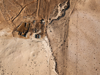 Aerial view of a desert landscape on the island of Lanzarote, Canary Islands, Spain. Desert background, texture. Sand and desolate land