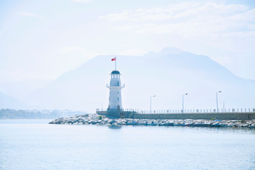 Landscape and lighthouse of Alanya port with Turkish flag, Alanya, Turkey