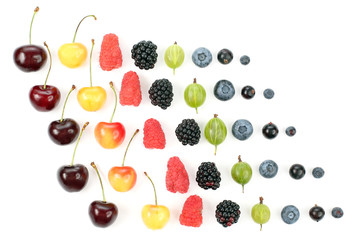 different juicy berries are laid out in rows on a white background