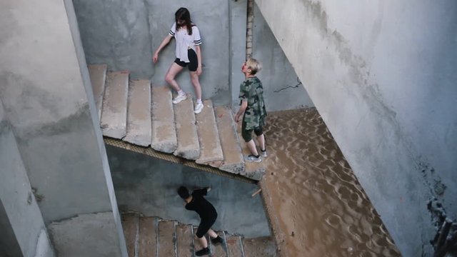Zombies walking on the stairs in the abandoned building