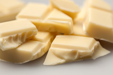 broken white chocolate on a white background