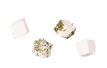 Feta cheese cubes on white background