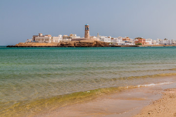 Fototapeta na wymiar Ayjah neighborhood with its lighthouse in Sur, Oman