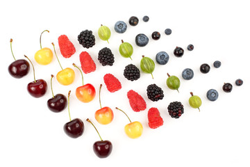 many different juicy berries are arranged in order on a white background