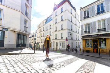 girl is walks around Montmartre