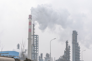 smoke from chimney on background of blue sky
