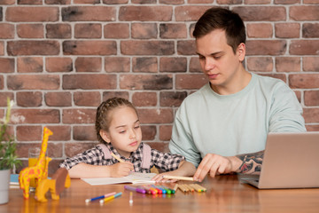 Fototapeta premium Father teaching daughter to distinguish colors