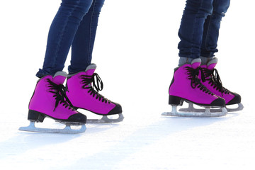 Female legs in skates on an ice rink. sports, Hobbies and recreation of active people.