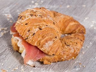 sandwich made with croissant cheese and Parma ham