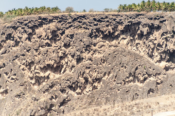 Cliffs at Wadi Dharbat near Salalah during the dry season, Oman.