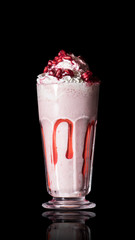 Pomegranate smoothie on black isolated background