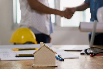 hand shake of building contractor and investor or engineer , successful negotiation