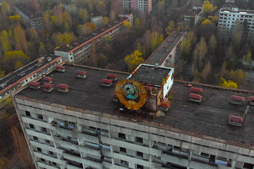 Soviet coat of arms on a high-rise building in Pripyat, view from above. Pripyat aerial panorama...