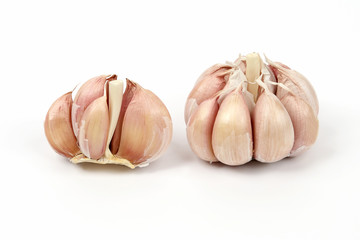 heads of garlic on a white background