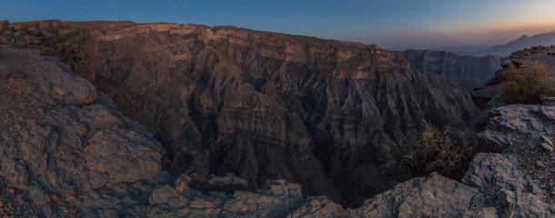 Sunset at Wadi Ghul canyon in Hajar Mountains, Oman