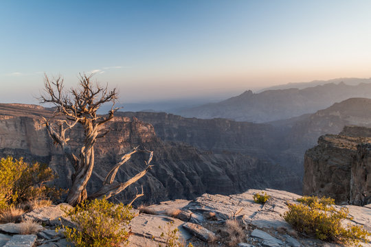 Sunset at Wadi Ghul canyon in Hajar Mountains, Oman