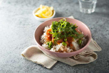 Healthy rice bowl with smoked salmon