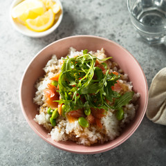 Healthy rice bowl with smoked salmon
