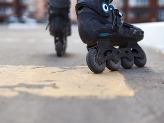 Fototapeta na wymiar Close-up of roller skates. Roller skating in the city