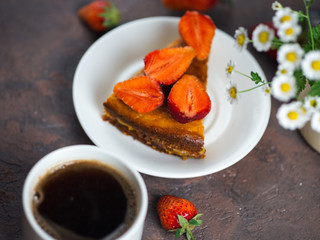 Naklejka na ściany i meble A Cup of espresso and strawberry pie on the table
