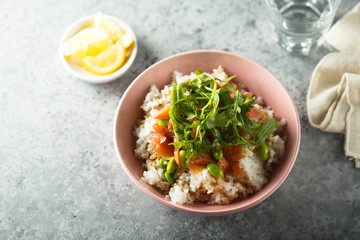 Healthy rice bowl with smoked salmon