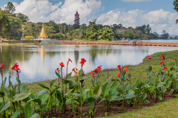 PYIN OO LWIN, MYANMAR - NOVEMBER 29, 2016: Flowers and a lake in National Kandawgyi Botanical gardens in Pyin Oo Lwin, Myanmar