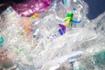 Reverse vending machine, PET crusher, crushed plastic bottles 