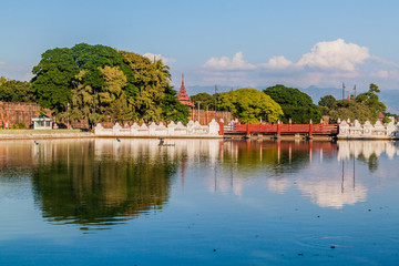 Fototapeta na wymiar Moat, bridge, walls and tower of Mandalay Fortress, Myanmar