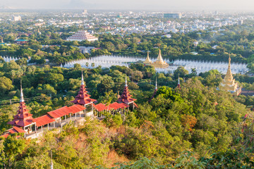Fototapeta na wymiar Aerial view of the city from the Mandalay hill, Myanmar. Sandamuni Pagoda and Atumashi Monastery visible.