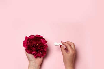 Medical concept of artificial insemination. In vitro fertilization. Red peony flower with plastic...
