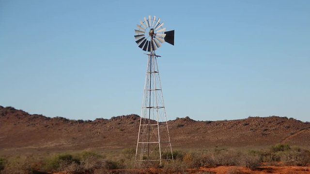 Windmill Or Windpump In A Field On A Warm Sunny Day