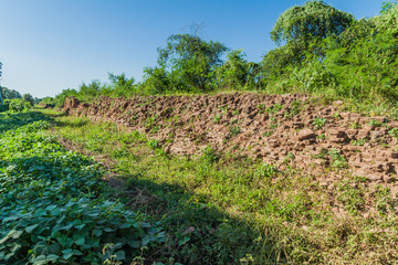 Fototapeta na wymiar Remnants of the wall of the ancient town Inwa (Ava) near Mandalay, Myanmar