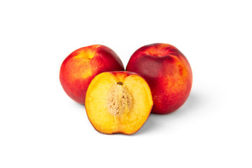 Fototapeta na wymiar Two peaches and a half isolated on white background.