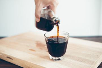 cold brew coffee Black coffee in a glass, add milk