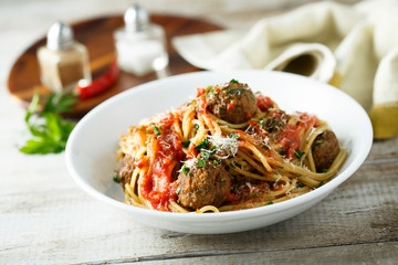 Homemade pasta with meatballs and tomato sauce