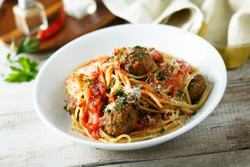 Homemade pasta with meatballs and tomato sauce