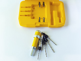 .The countersink set consists of a nozzle for a quick change of the drill bit and a set of interchangeable countersink drills. Drill for screwdriver. Woodworking.