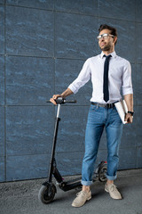 Elegant guy with scooter