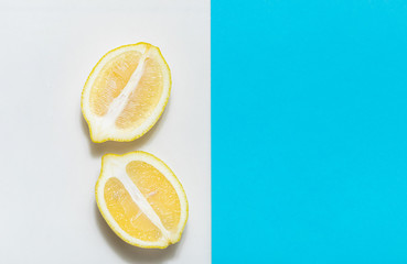 Lemons on white and blue background close up