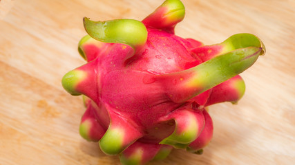 delicious dragon fruit in a cut and completely red and white