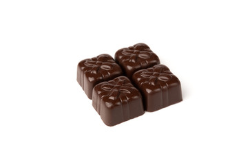 Chocolate sweets in heart shape isolated on white background.