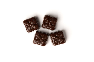 Chocolate sweets in heart shape isolated on white background.