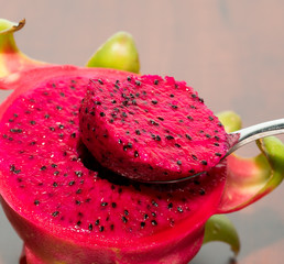 delicious dragon fruit in a cut and completely red and white