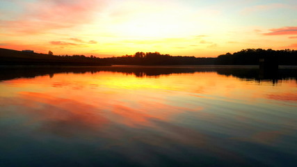 Fototapeta na wymiar Sunrise Over the Water