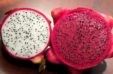 delicious dragon fruit in a cut and completely red and white