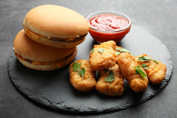 Nuggets, two cheeseburgers and chili sauce