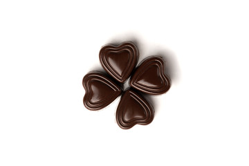 Chocolate sweets in heart shape isolated on white background.
