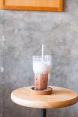 Glass of ice cocoa with  milk foam after finished drinking