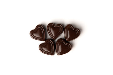 Chocolate sweets in heart shape isolated on white background.